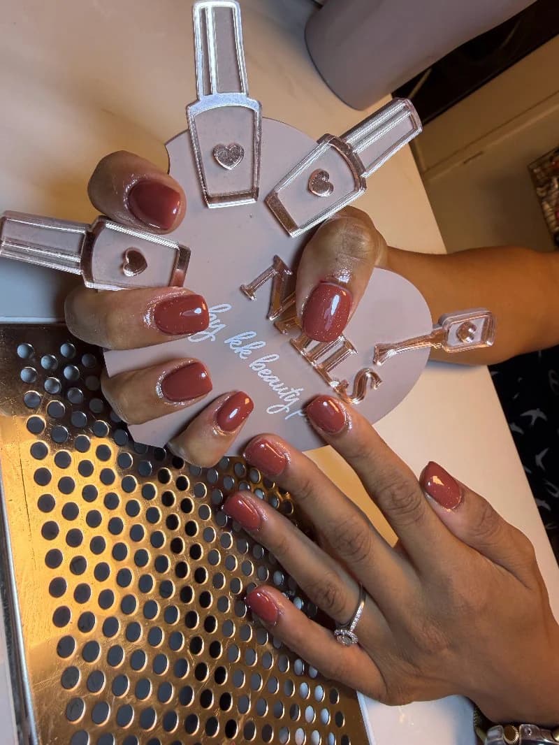Chocolate brown gel on short rounded nails