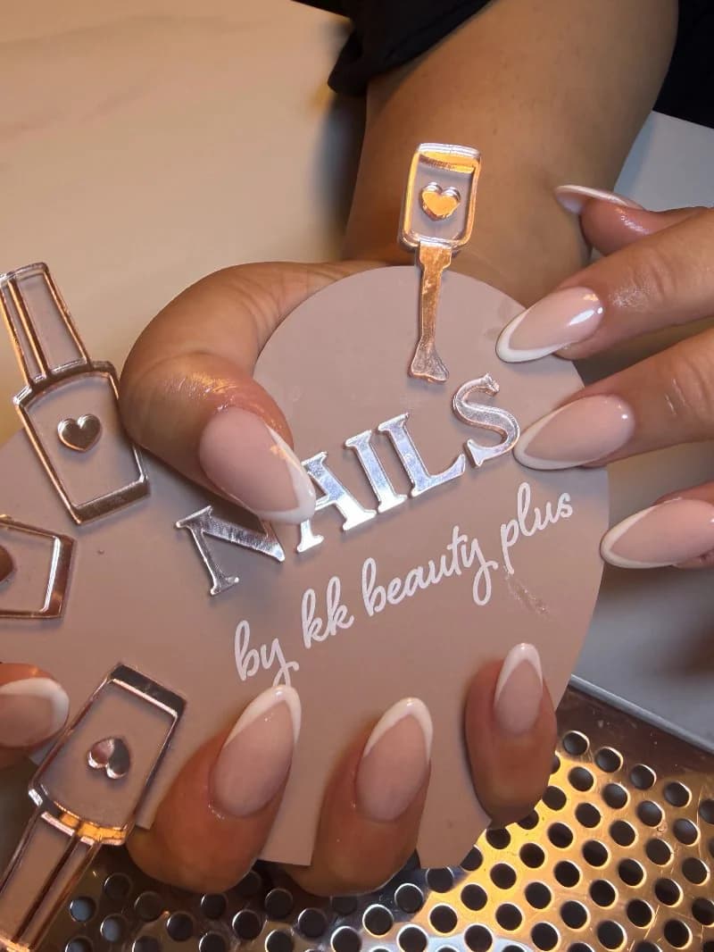 Sheer pink almond nails with fine white French tips