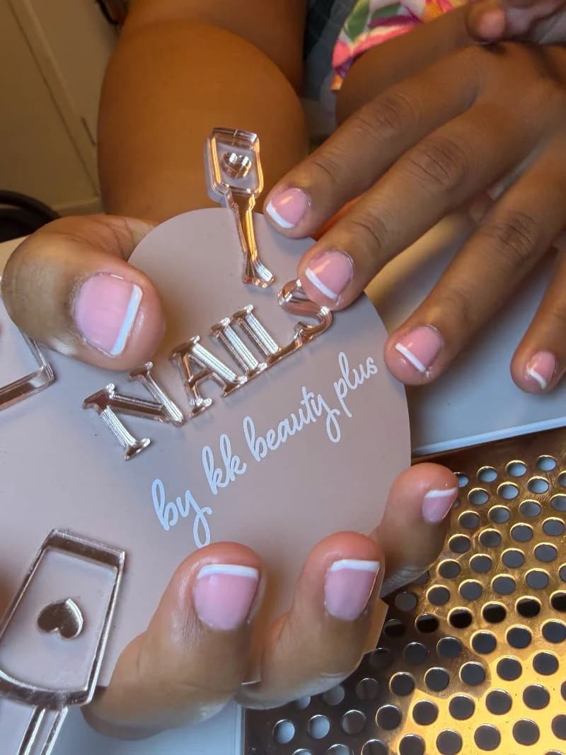 Sheer pink nails with thin white micro French tips