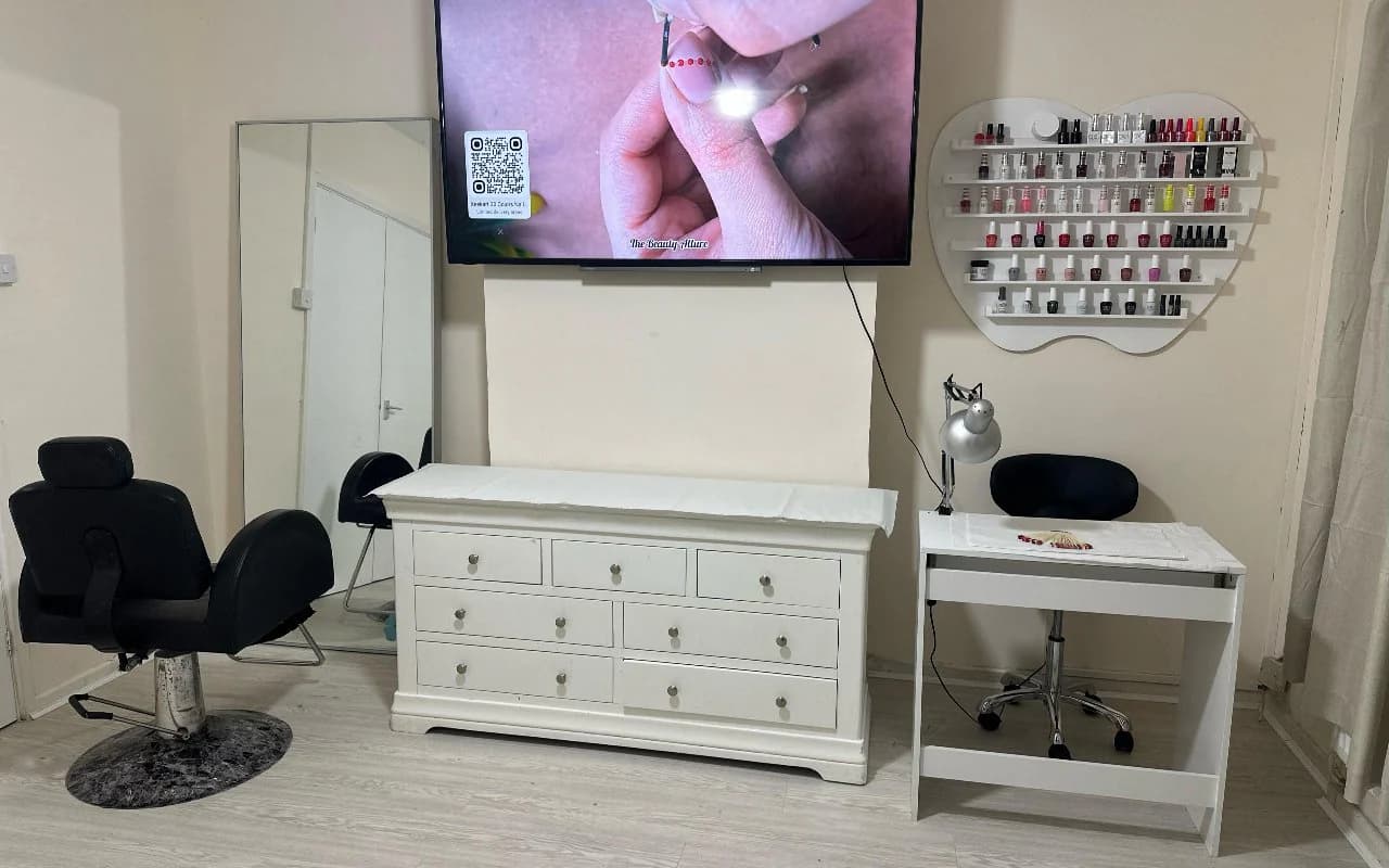 The main nail room: reclining client chair, manicure desk and the full gel polish wall