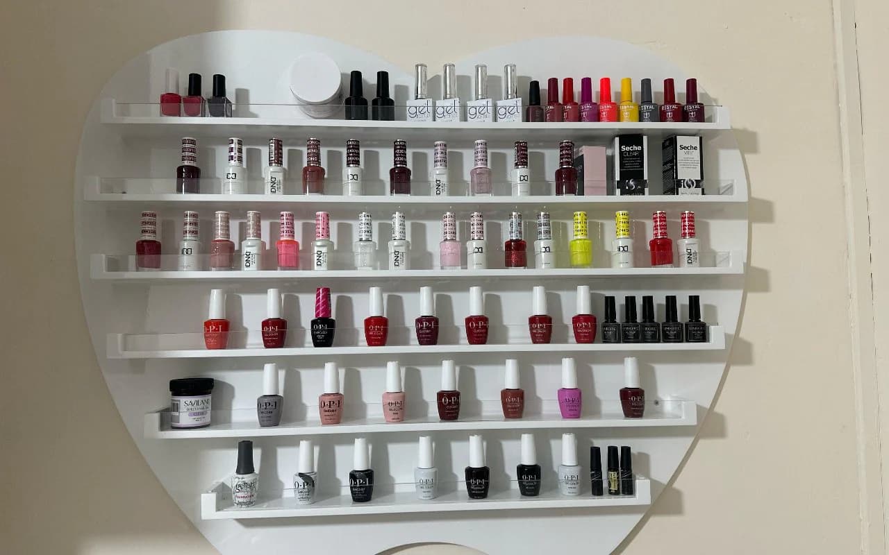 The heart-shaped polish wall stocked with gel colours from soft nudes to deep reds