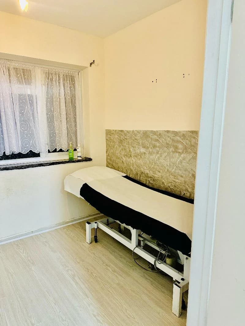 The treatment room by the window, couch made up for the next appointment